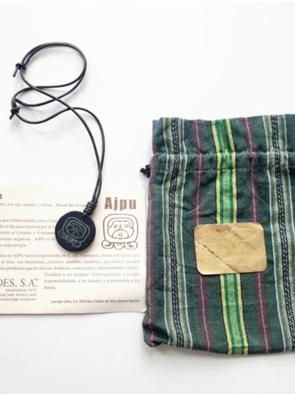 Black Ajpu Necklace Pendant with Striped Green Drawstring Pouch